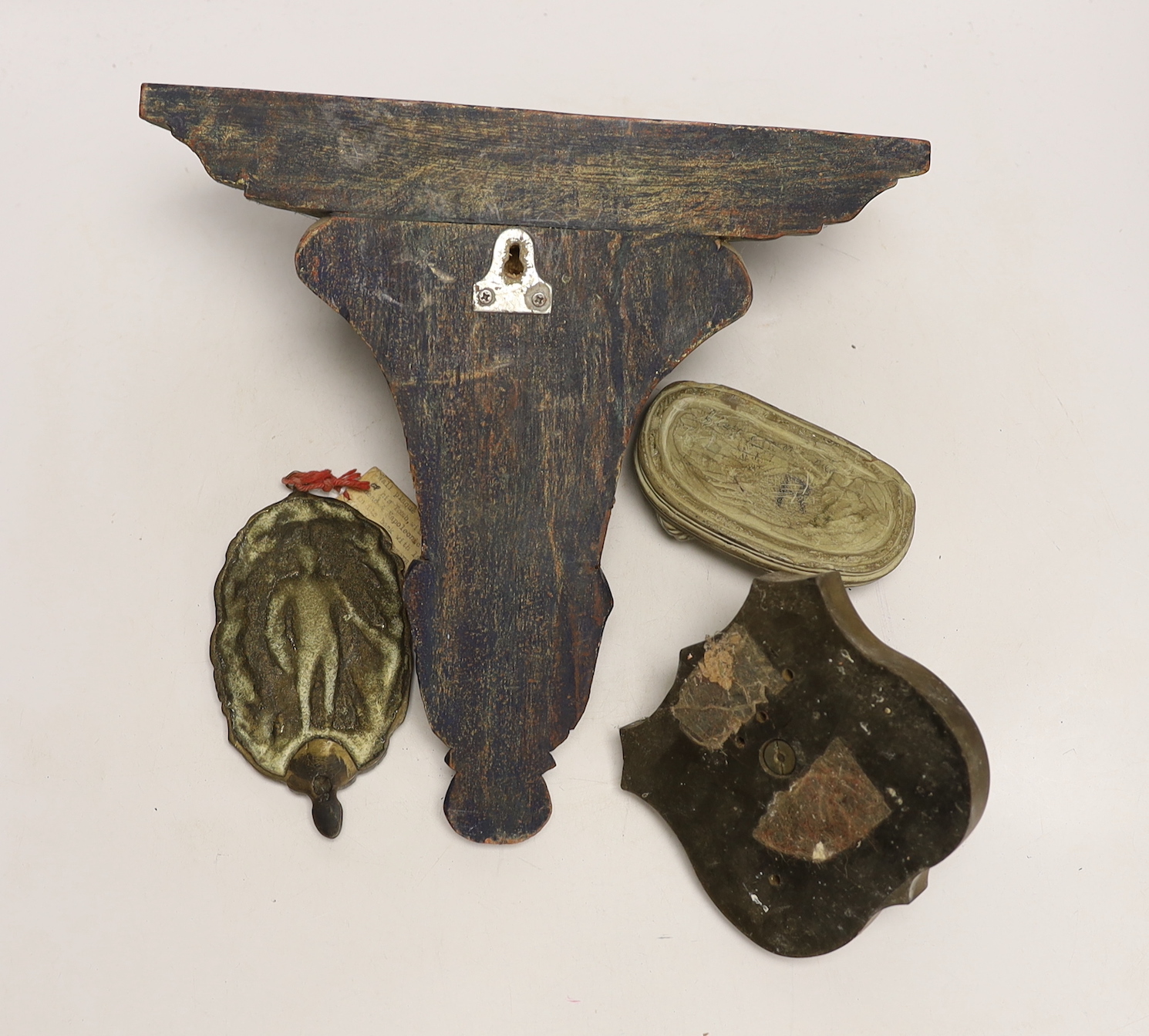 Sundry items including a wood bracket, a crocodile carving, a lion mask and a wall plaque depicting Napoleon
